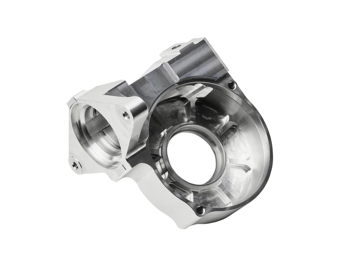 Precision CNC milled aluminum motor housing with internal cavity and circular bearing features