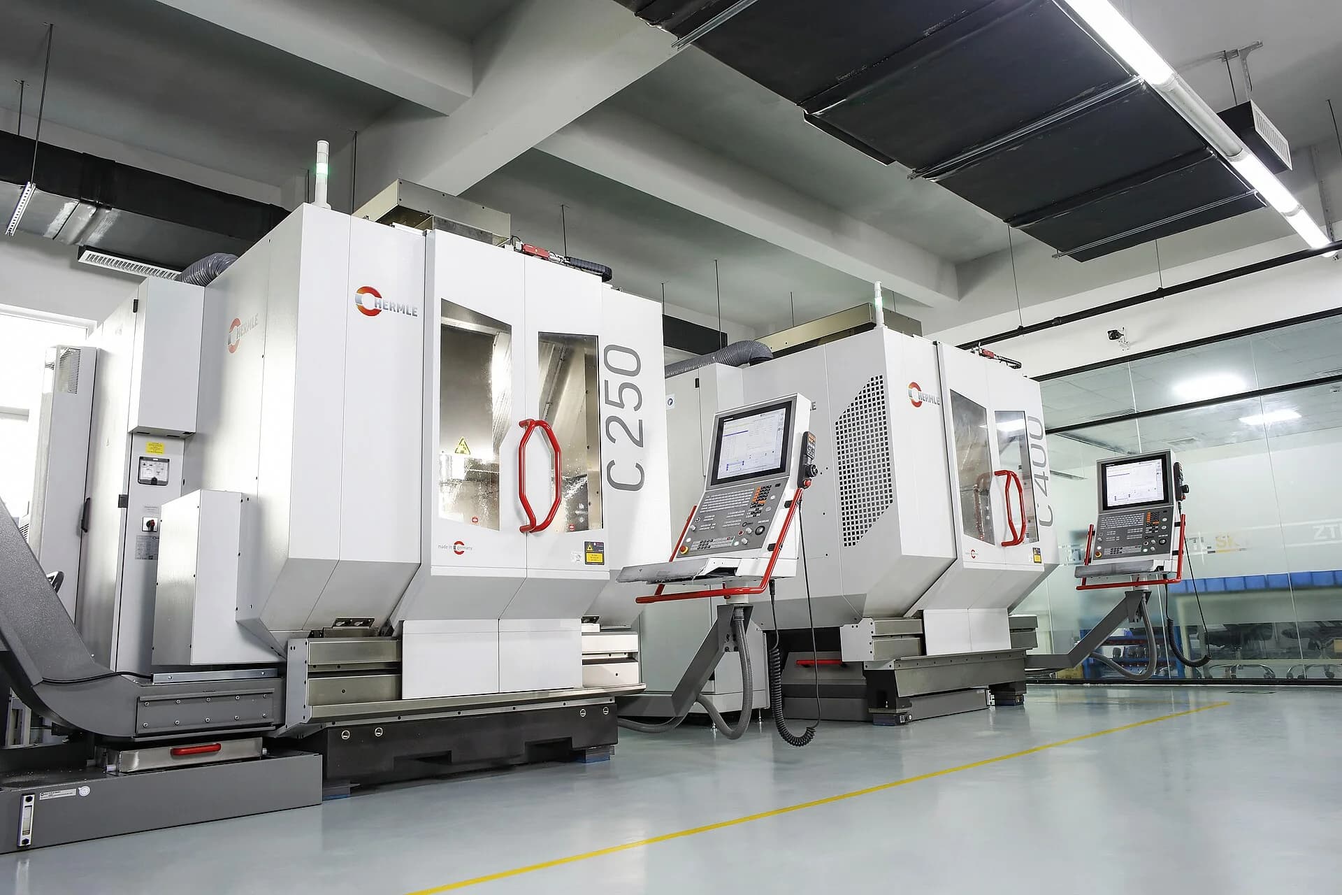 Large five-axis CNC machining centers in a clean precision manufacturing facility