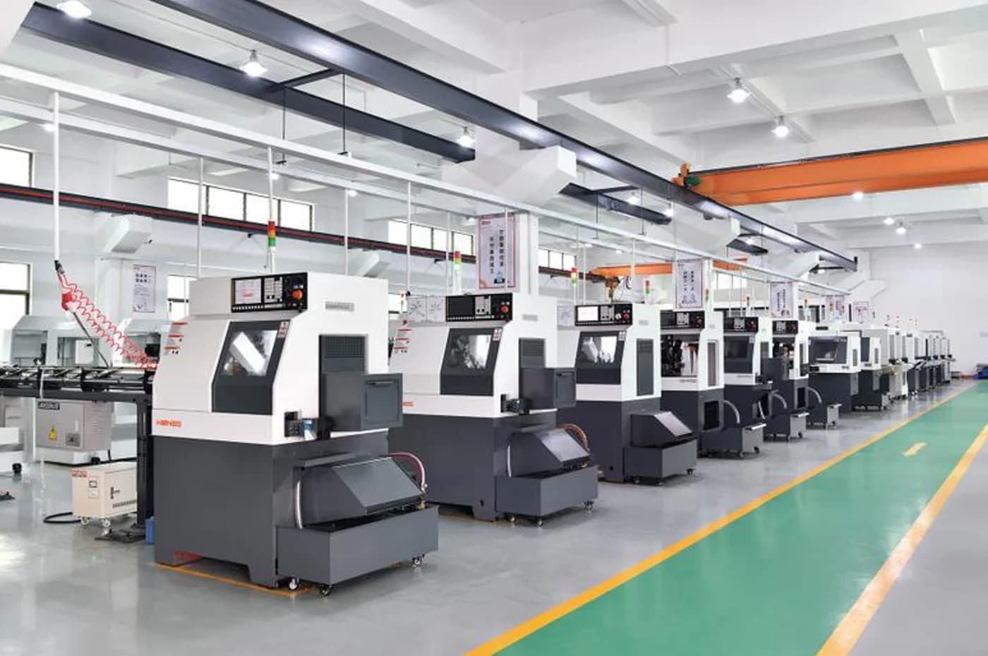 Swiss CNC machine shop with a row of bar-fed automated production machines