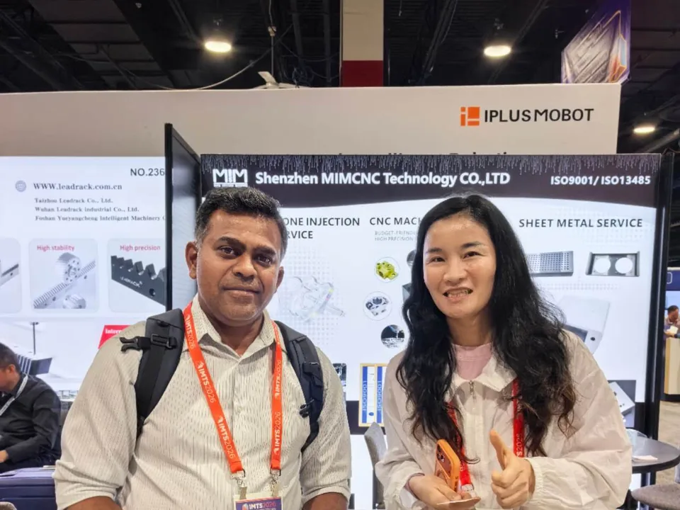 MIM Machining representative meeting an aerospace manufacturing customer at IMTS Chicago