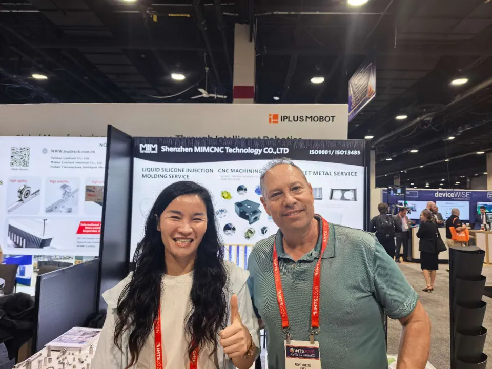 CNC manufacturing partnership discussion at the MIM Machining IMTS booth