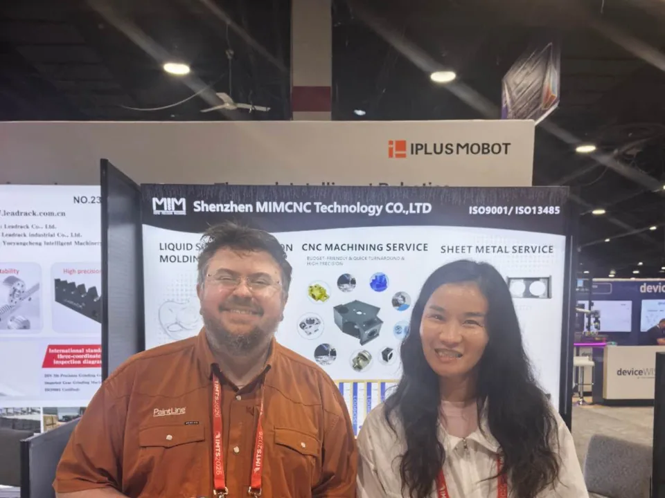 Injection molding and CNC manufacturing partnership meeting at the IMTS exhibition
