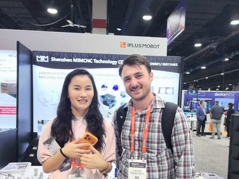MIM Machining team presenting manufacturing capabilities to IMTS visitors