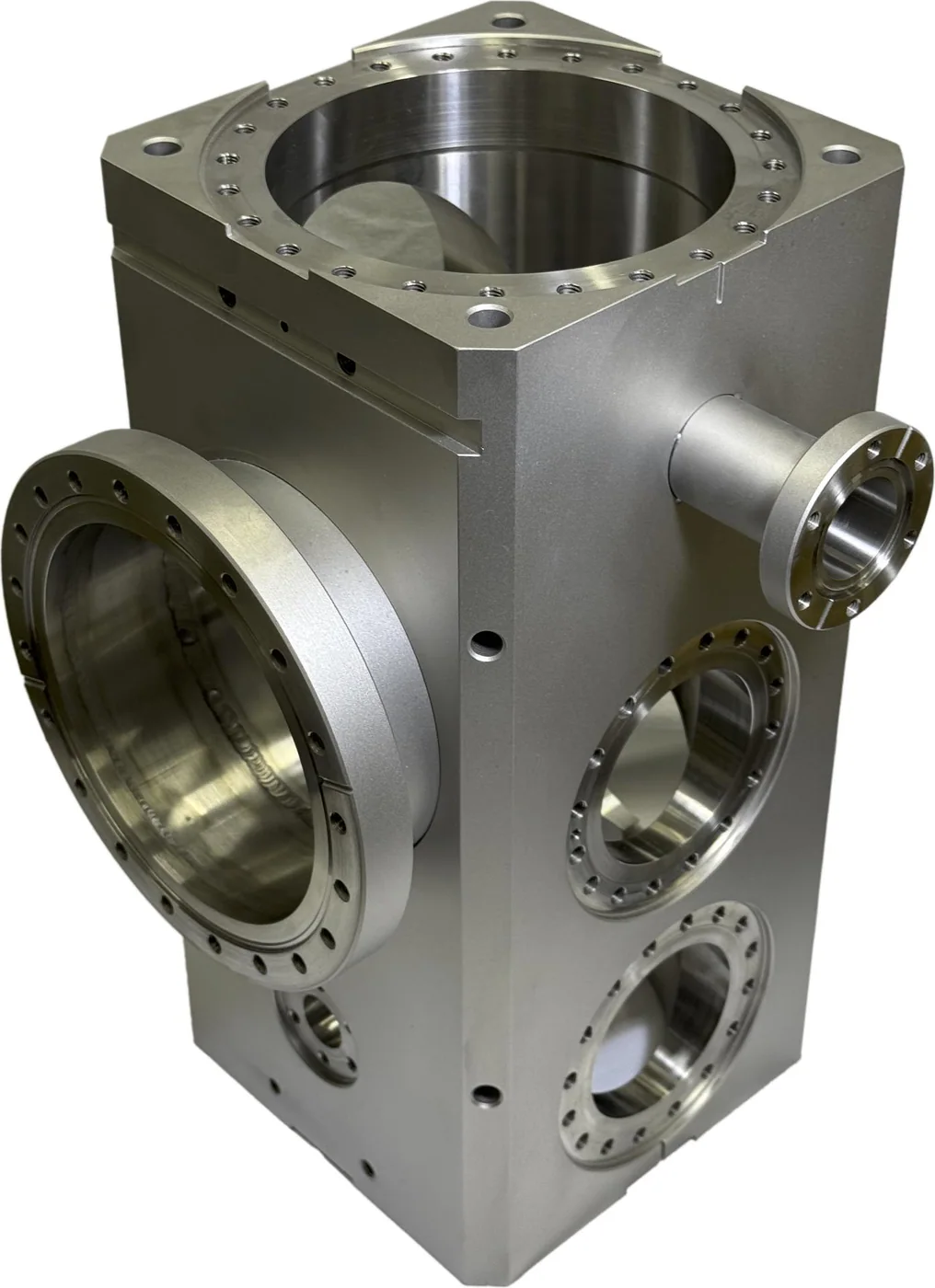 Oversized CNC machined industrial housing with large bores flanges and multi-side mounting features on a white background