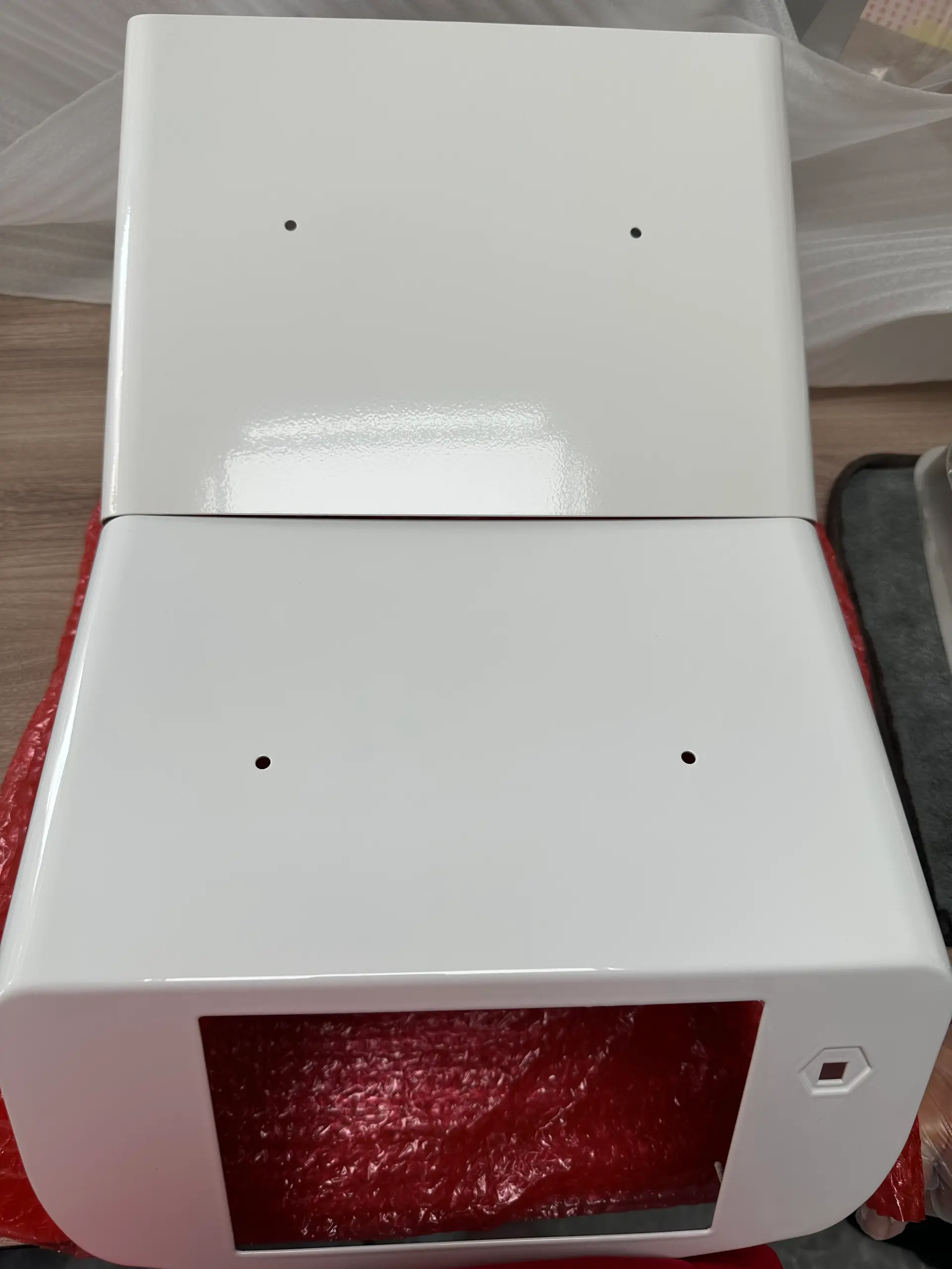White powder-coated sheet metal enclosure covers showing a glossy protective finish