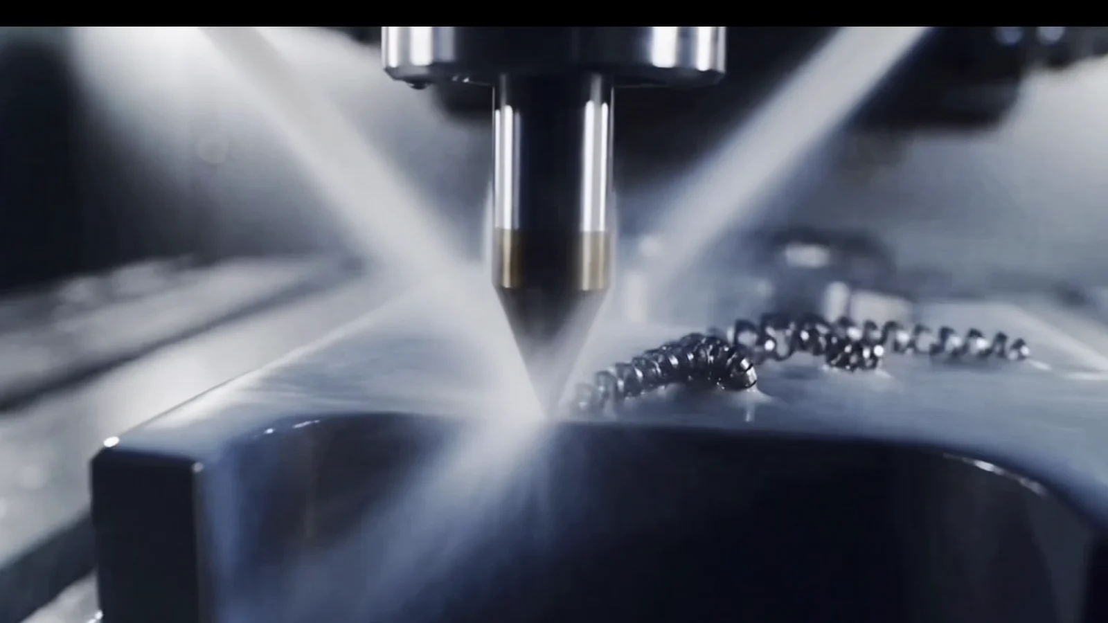 CNC cutting tool machining a precision component with coolant during the manufacturing process