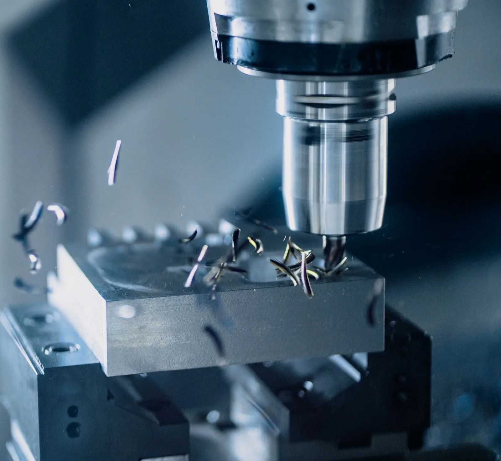 Precision CNC milling cutter machining a natural silver aluminum workpiece