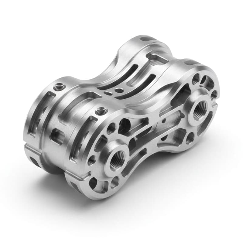 Complex 5-axis CNC machined silver housing with contoured pockets bores and threaded holes on a pure white background