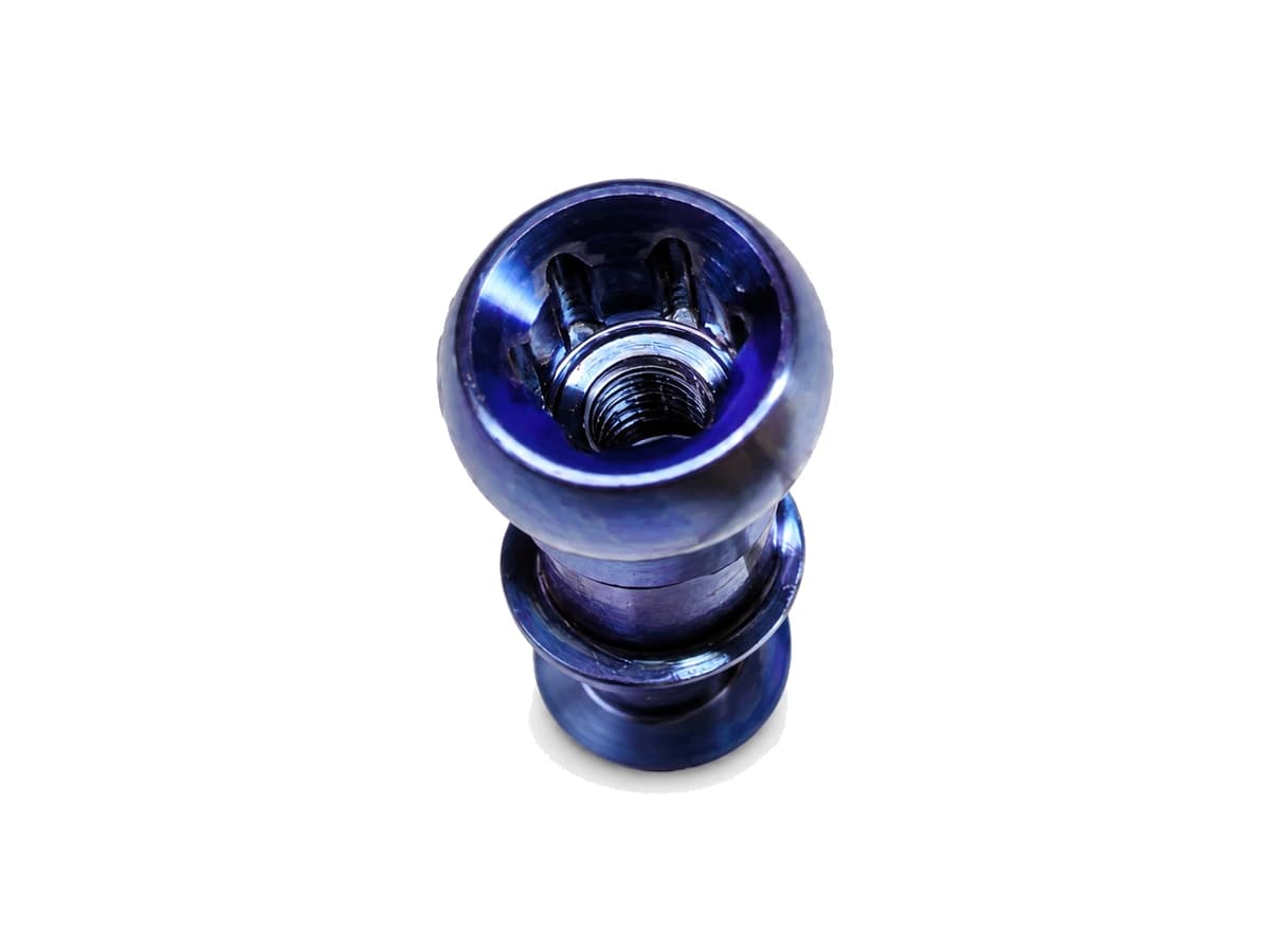 Blue purple titanium alloy medical component with internal socket and thread on a pure white background